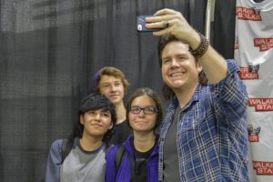 Josh McDermitt, who plays the character of Eugene on The Walking Dead, takes a selfie with fans. McDermitt was one of more than 30 cast members who attended Walker Stalker Con. Photo by Emma Dakin.
